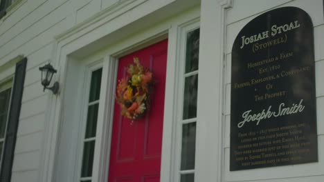 Focus-pull-of-the-sign-and-door-Original-Historic-House-of-Josiah-Stowell-friend-of-Joseph-Smith-hired-him-for-money-or-Treasure-digging-in-the-early-1820s-Mormon-Origins