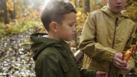 Kid-playing-outdoors-with-his-brother