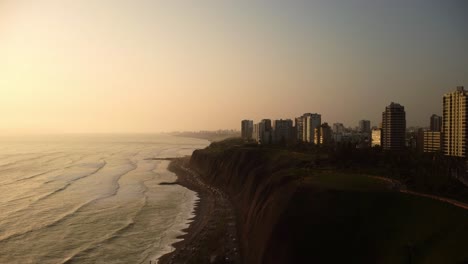 aerial drone view of the traffic on circuito de playas road and the coastline of miraflores, lima, peru
