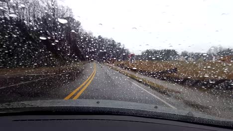 driving in the rain on a country road
