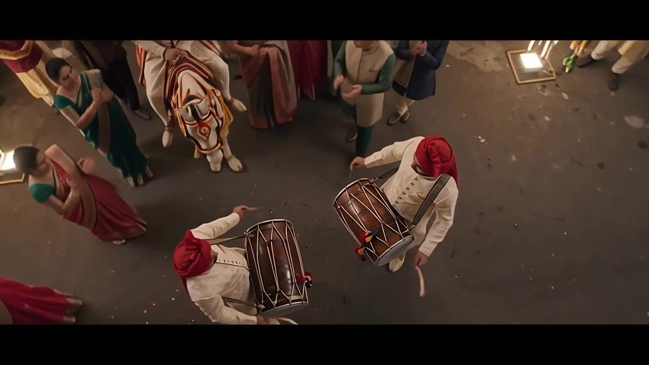 Traditional Indian Wedding Procession with Dhol Players and Groom on Horse