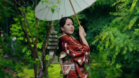 woman in traditional japanese kimono in a garden