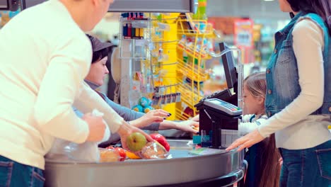 cash desk with cashier and terminal in hypermarket