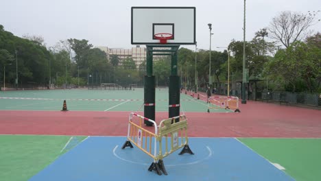 an empty basketball court is seen at a closed playground due to covid-19 coronavirus outbreak and restrictions in hong kong