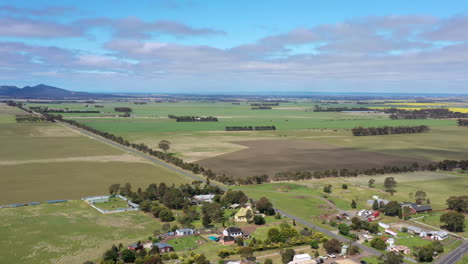 aerial reveal of country farmland and you yangs mountain ranges, australia