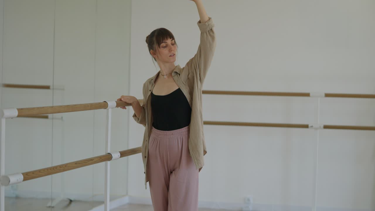 Ballet Dancer Practicing at the Barre