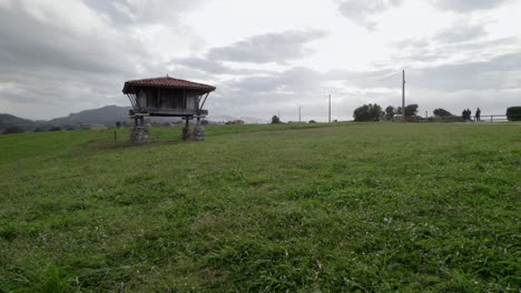 Slow-ground-dolly-shot-from-a-horreo,-typical-granary-from-Asturias-the-north-of-the-Iberian-Peninsula,-traditional-farm-building