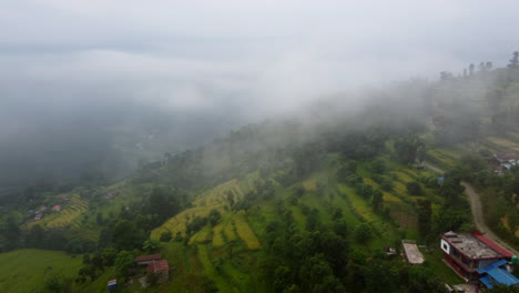 foggy clouds over rice terraces and valleys in nepal villages