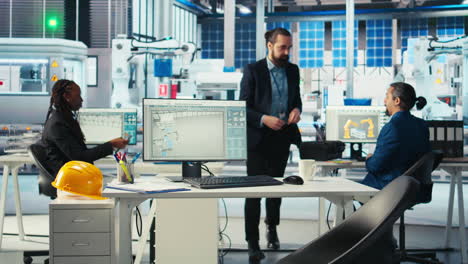 supervisor coordinating with technicians, inspecting photovoltaics factory
