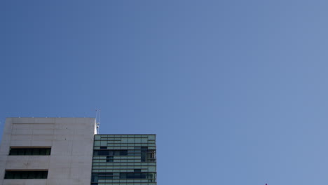 airplane flying over a building