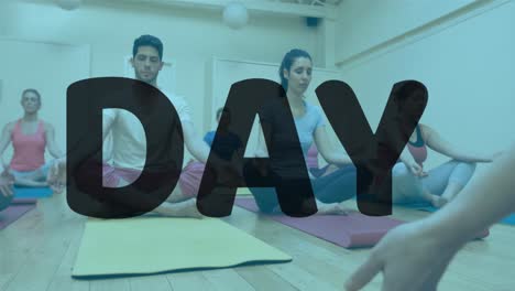 animation of pizza day text banner over group of diverse fit people practicing yoga at the gym