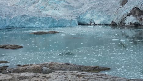 Close-up-of-a-glacier-in-the-Arctic-Sea-along-the-northern-coastal-line-of-Svalbard-during-a-boat-travel-expedition