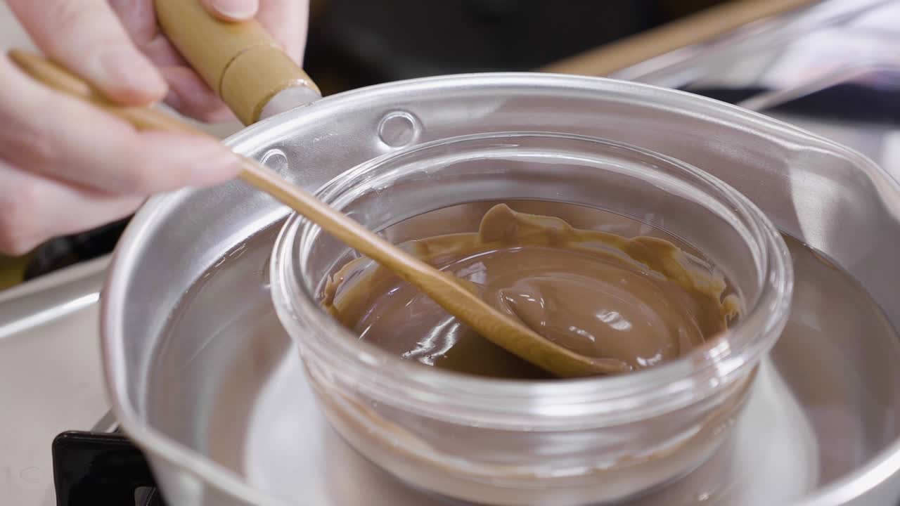 Chocolate glaze on stove mixing process
