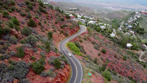 Car-Passing-"Entering-Jerome"-Sign-on-Twisty-Highway-AZ-89A