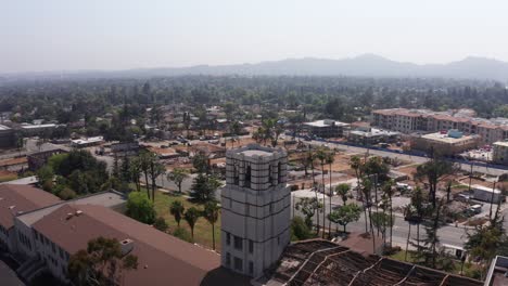 close-up reverse pullback aerial shot of the eliot arts magnet academy on lake street after the eaton fire in altadena, california. 4k