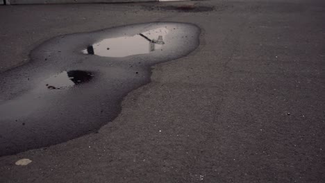 slowmotion footage of skater doing his thing on icelandic roads, in a foggy, dramatic landscape