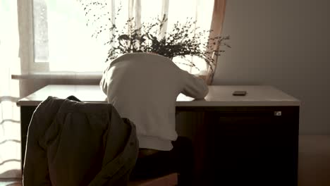 man sitting at desk stressed, anxious, worried and frustrated - static, conceptual