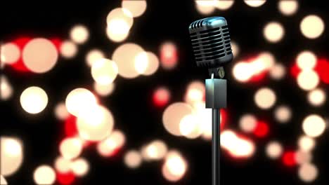 retro metallic microphone against red and yellow spots of light against black background