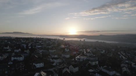 aerial video of the city of trondheim in the sunset