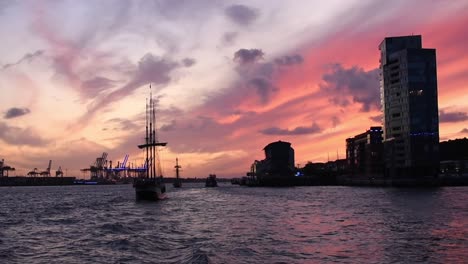 View-of-the-harbour-of-Hamburg,-Germany-during-a-dramatic-sunset