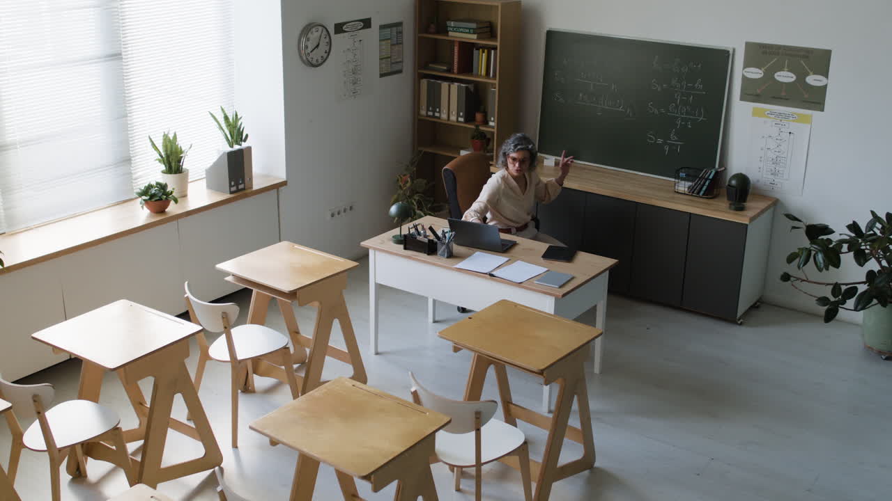 Classroom scene of a teacher lecturing