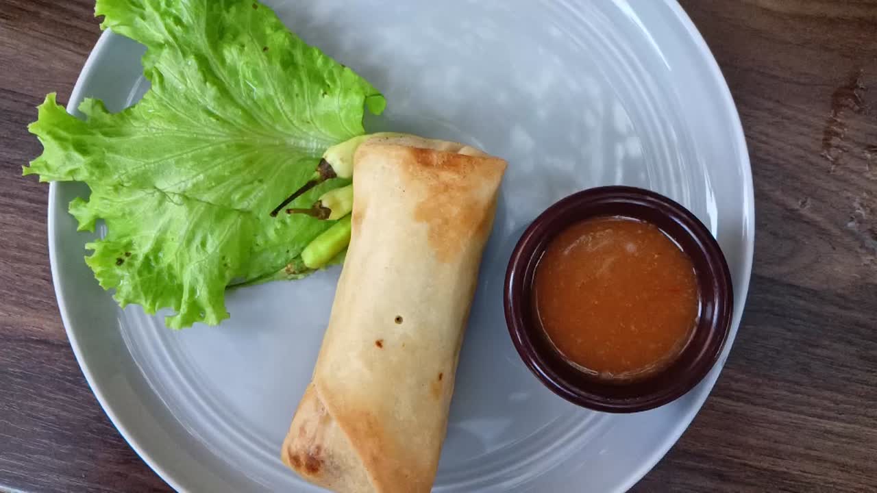 Lumpia, Fried spring roll filled with young bamboo shoots, typical of Central Java. This Indonesian fried snack is usually eaten for snacks, breakfast, and breaking the fast