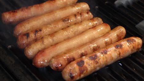 grilling sausages on a barbecue over time