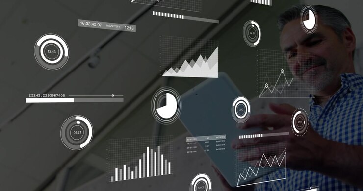 Business professional tapping tablet and swiping screen, animating data charts over blurred ceiling