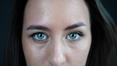 portrait of funny young woman with facial expressions, surprised, scared, moving green eyes and eyebrows, close up