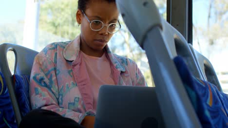 female commuter using laptop while travelling in bus 4k