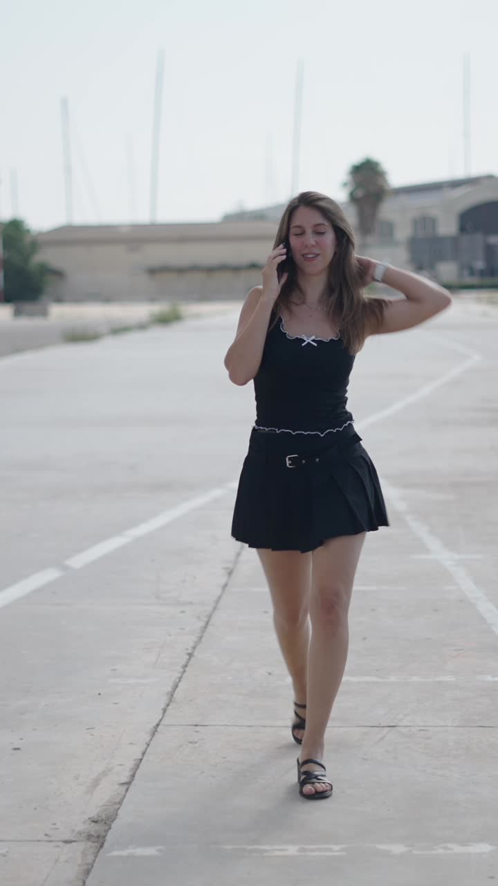 Woman walking and talking on the phone