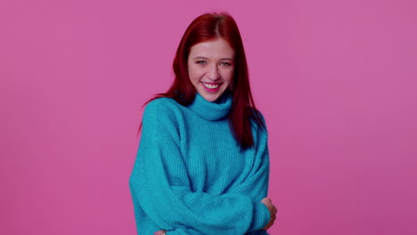 Cheerful-lovely-teenager-student-girl-fashion-model-in-blue-sweater-smiling-and-looking-at-camera