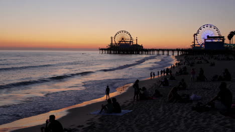 vibrant sunset over santa monica pier beach