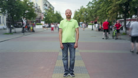 man standing on a city street