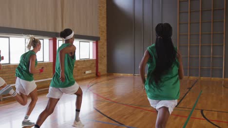 diverse female basketball team running and wearing sportswear