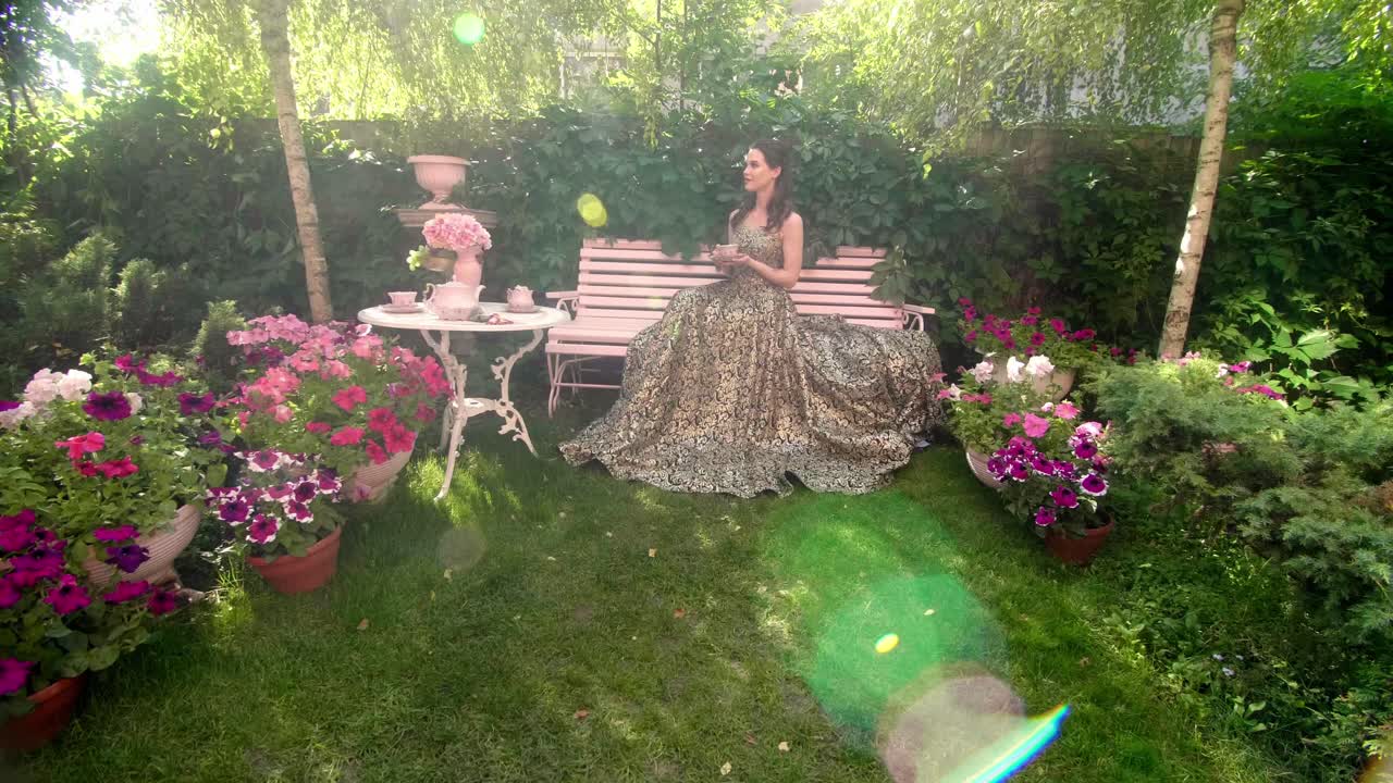 Woman enjoying tea in a beautiful garden