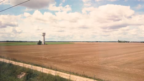 Static-Shot-Taken-from-the-Inside-of-The-TGV,-The-Famous-French-Fast-Train-During-Sunny-Day,-Crossing-the-fields-in-France