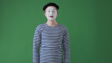 mime artist gesturing ok and thumbs up sign