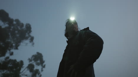 flashlight, nature and man on an outdoor adventure