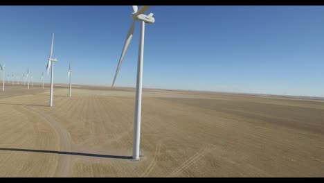 raising drone view of wind turbines in colorado