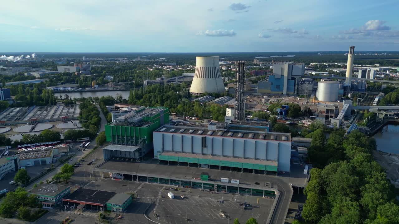 Waste incineration plant, waste to new energy sources, polluting the atmosphere and contributing to climate change. Beautiful aerial view flight descending drone
