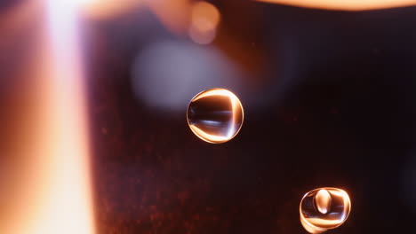 abstract close-up of water droplets with warm bokeh lighting
