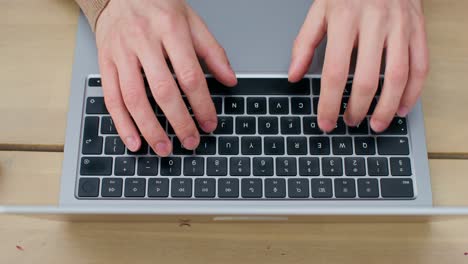 person typing on a laptop