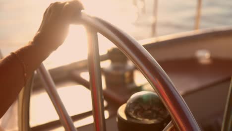 captain rides vessel on the sunset