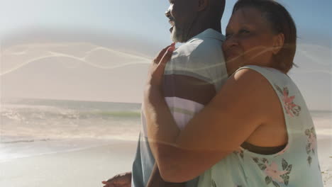 man and woman hugging on beach, with animated heart icon and health chart floating above
