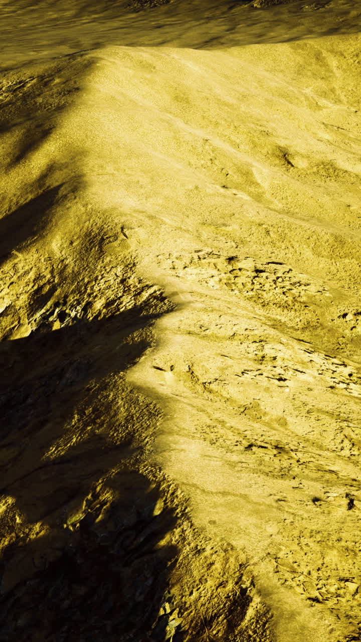 Exploring the rugged terrain of an alien landscape under a golden hue