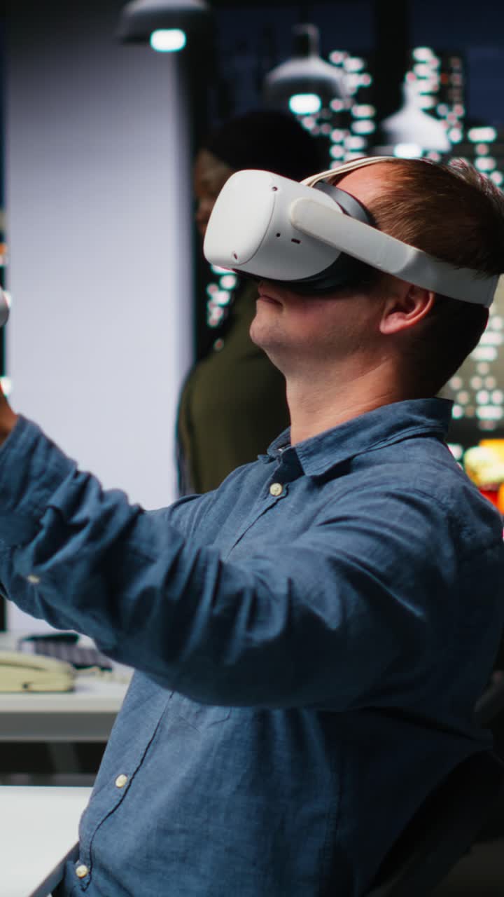 Vertical Video Professional male developer operating VR glasses to create spaceship station