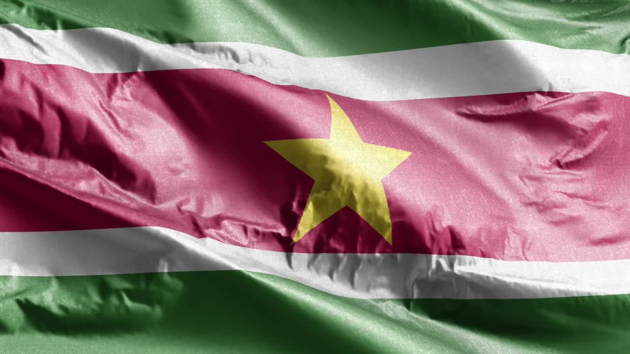 bandera textil de surinam ondeando en el bucle del viento. bandera surinamesa balanceándose en la brisa. tejido textil de tela. fondo de relleno completo. bucle de 10 segundos.