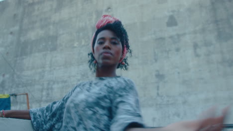 graceful african-american woman dancing tango alone on a rooftop