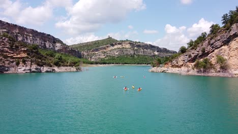 congost de mont rebei canyon, catalonia and aragon, north spain - aerial drone view of tourists kayakking at the blue noguera ribagorzana river lake